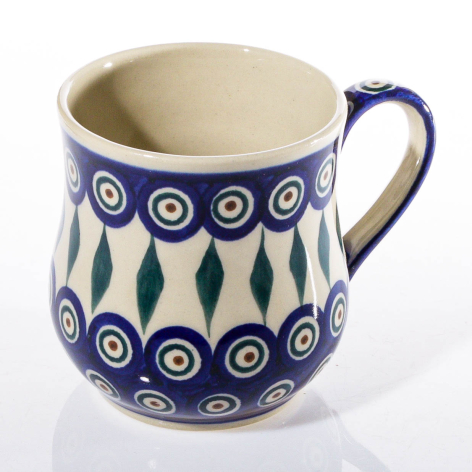 Blue and cream ceramic jug with hand-painted circular and leaf patterns, front three-quarter view