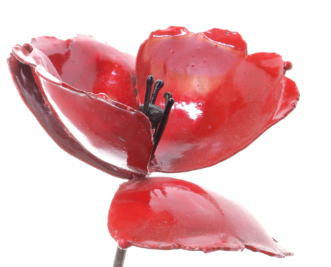 Red leather bowl with organic petal-like segments and dark stitching detail, front view