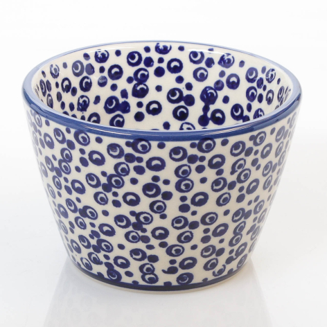 Blue and white ceramic bowl with hand-painted circular dot pattern throughout, front view