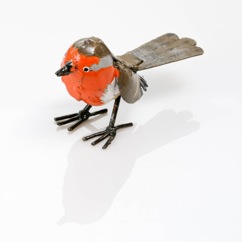 Handcrafted metal robin figurine with bright red-orange body, grey wings, and black feet, front three-quarter view
