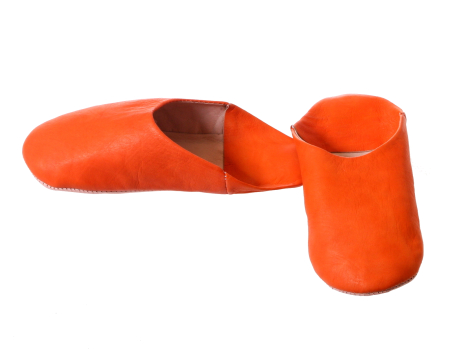 Bright orange fabric storage basket with brown interior lining, cylindrical shape shown open and folded flat