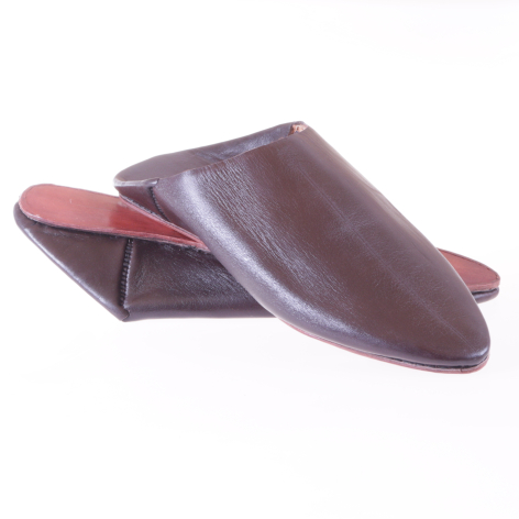 Brown leather babouche slippers with pink inner lining, displayed open to show interior detail