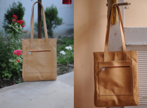Tan leather tote bag shown in two views: outdoors with green foliage and indoors displaying front panel and handles