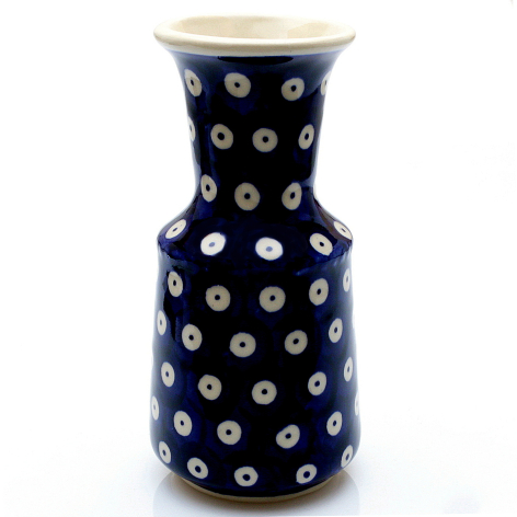 Dark blue ceramic vase with white dotted pattern and cream-colored rim, cylindrical shape with wider shoulder detail