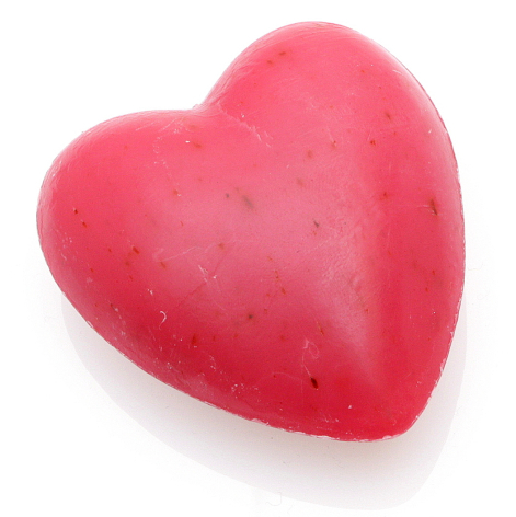Bright pink heart-shaped soap with textured surface, angled three-quarter view against white background