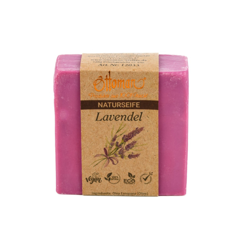 Handmade lavender soap bar with natural kraft paper label wrapped in vibrant pink packaging, front view