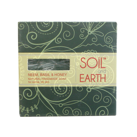 Green textile bundle with ornamental swirl pattern, cream label band featuring "Soil and Earth" text, front view