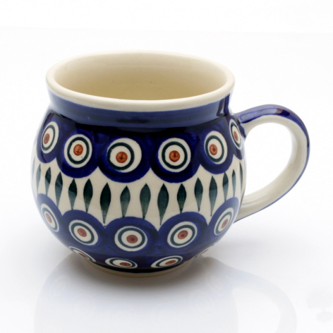Deep blue ceramic mug with cream interior, gold circular and geometric patterns, rounded bulbous shape
