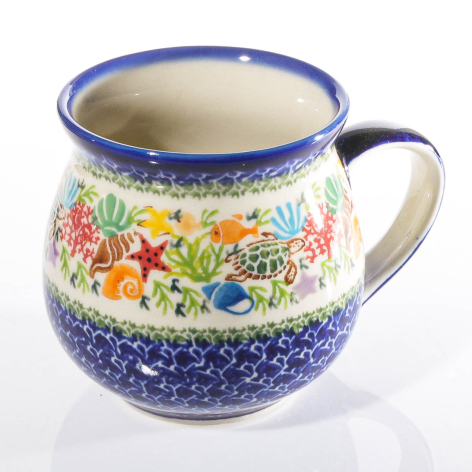 Blue and cream ceramic pitcher with colorful floral design and dotted texture pattern, front view